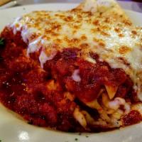 Homemade Lasagna · Layers of lasagna noodles, beef, Italian sausage, 7 different types of cheese, a blend of ma...