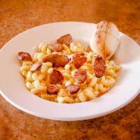 Gourmet Mac and Cheese · Cavatappi and creamy cheese sauce. Served with a garlic roll and house or Caesar salad.