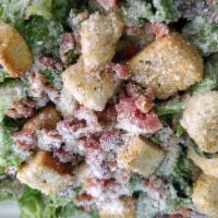 Caesar Salad  · Lettuce, bread croutons, Parmesan cheese, cripsy bacon chunks, Caesar dressing.			
			