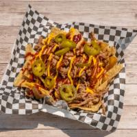 BBQ Nachos · Loaded with pulled pork, cheese sauce, BBQ sauce, and topped with jalapenos.