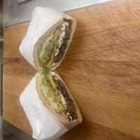 Tortas  · Filled with refried beans, lettuce, tomato, mayo, oaxaca cheese, jalapeño and avocado. 