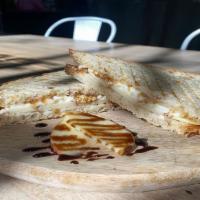 The G.O.A.T. Panini · Hand Crafted Panini with sliced Honey Crisp Apples, Goat Cheese,, and Fig Jam. Drizzled with...