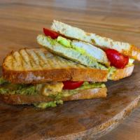 Chicken Avocado Panini · Grilled Chicken Breast, Avocado, tomatoes, and Micro Arugula. Made with Handcrafted Sourdoug...