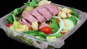 Antipasto Salad · Fresh sliced hot ham, Genoa salami and provolone cheese smothering our signature garden salad.
