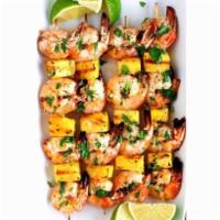 Grilled Shrimp & Pineapple Skewers · Comes with garlic cilantro butter four grilled shrimp & pineapple skewers with garlic cilant...