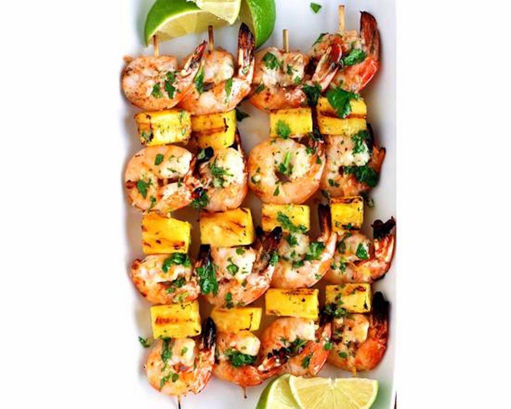 Grilled Shrimp & Pineapple Skewers · Comes with garlic cilantro butter four grilled shrimp & pineapple skewers with garlic cilantro butter.