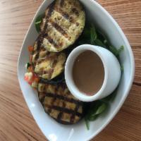 Garlic Roasted Grilled Eggplant Bowl · Served on your choice of chopped Romaine lettuce or turmeric rice and your choice of dressing.