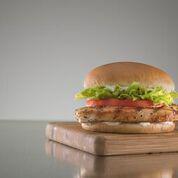 Grilled Chicken Sandwich · Juicy all-white meat chicken breast topped with crisp lettuce, ripe tomatoes, and Mayo on a ...