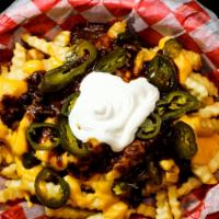Trash Can Fries · Golden fries smothered in chili, cheese, sour cream, and jalapenos.