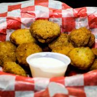 Bottle Caps · Tangy hand-breaded sliced pickles, deep-fried, and served with ranch dressing.