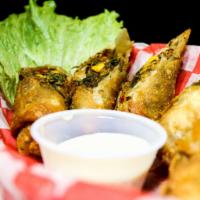 Southwest Eggrolls · Egg Rolls filled with southwest flavored chicken, corn, black beans and pepper jack cheese.