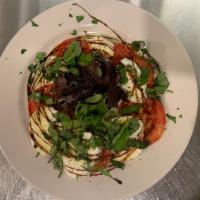 Caprese · Fresh mozzarella, sliced tomatoes, fresh basil, drizzled with extra virgin olive oil and ore...