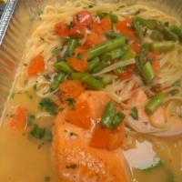 Salmon Scampi · Salmon sauteed in white wine sauce, onions, chopped tomatoes and asparagus.