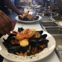 Pescatore · Sauteed jumbo shrimp, scallops, clams, calamari and mussels in our marinara sauce or white w...