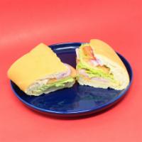 Sandwich Turkey & Cheese · Jamon de pavo y queso.