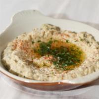 Babaganouj · Mashed smoked eggplant and sesame paste with garlic and lemon (dip for bread).