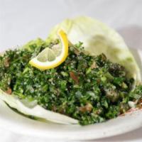 Tabouli Salad · Special Lebanese salad made with chopped parsley, tomatoes, onion and cracked wheat. 