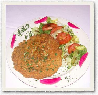 Ajhi · Lebanese omelet made with fresh herbs, onions, pine nuts and ground lamb. Served with salad. 