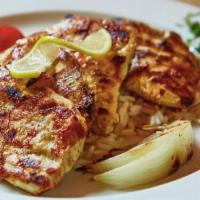 Shish Taouk · Grilled boneless chicken marinated in a special Lebanese garlic sauce, served with rice and ...