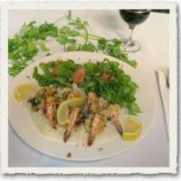 Tripoli Shrimp · Wild shrimp sauteed in provencale sauce, prepared with garlic, cilantro and butter. Served w...