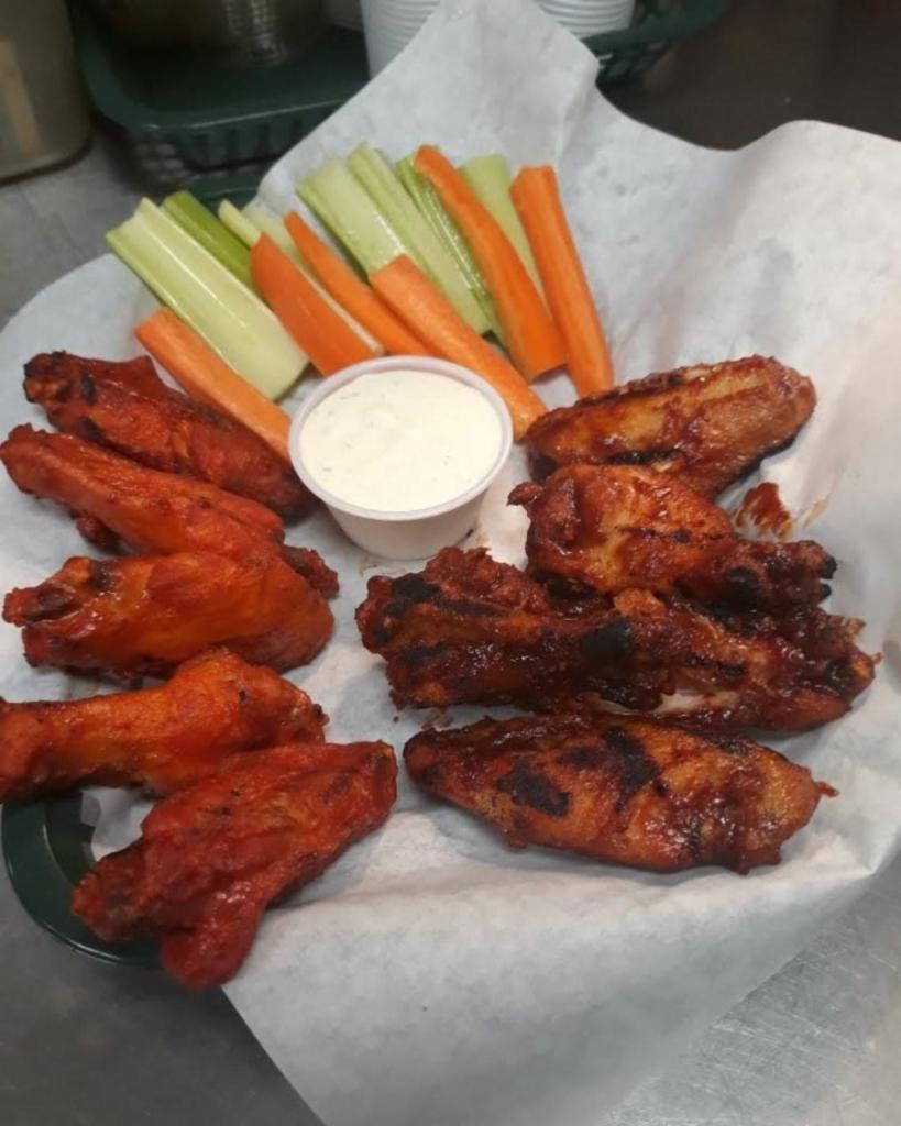 Chicken Wings · Tossed in your choice of buffalo sauce, lemon pepper, chipotle or BBQ sauce. Served with carrot and celery sticks with ranch dressing.