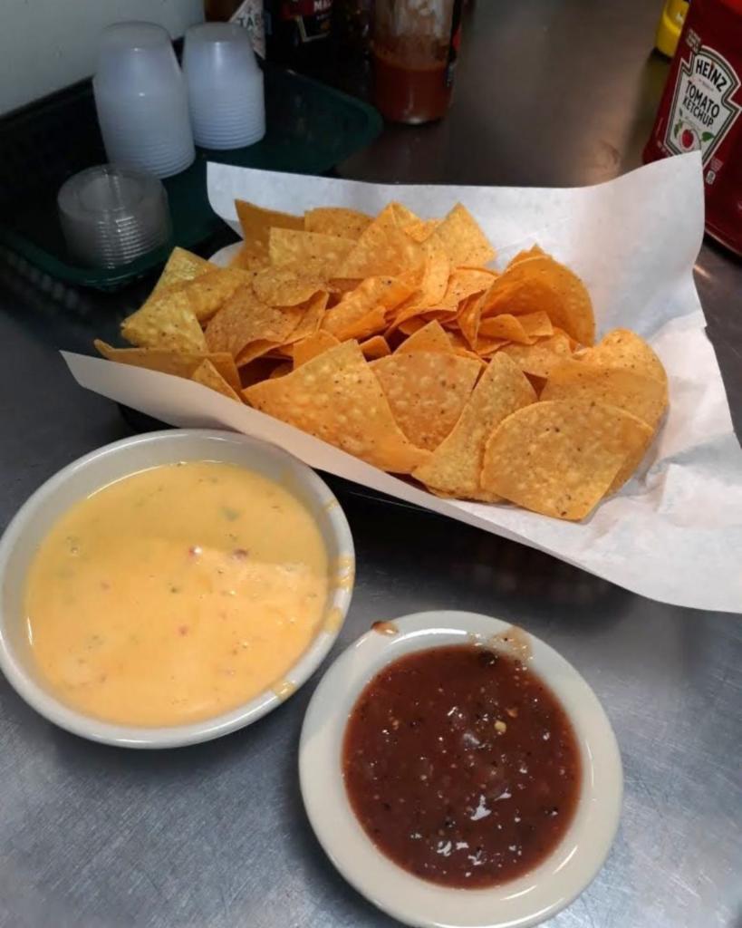 Green Chili Queso · Served with tortilla chips and salsa.