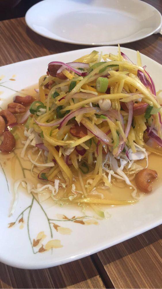 Mango Salad · Shredded mango, onion and scallion topped with cashew nut and mixed with a lime juice dressing.