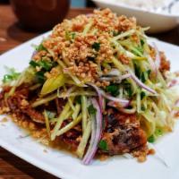 Soft Shell Crab · Soft shell crab breaded and deep fried topped with mango salad and peanuts.