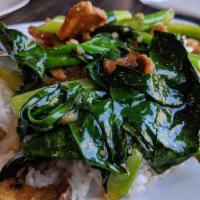 Kana Moo Grob · Sauteed crispy pork and Chinese broccoli over white rice.