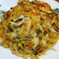 Seafood Pancake · Thai style pancake with fresh shrimp, crabmeat, squid and mussels served with sautéed bean s...