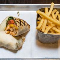 Buffalo Chicken Wrap · Crispy fried chicken, Buffalo sauce, blue cheese dressing, tomato and lettuce. Served with c...