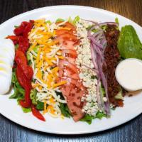 Cobb Salad · Romaine, roasted red pepper, hard boiled egg, tomato, red onion, bacon, cheddar and blue che...