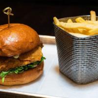 Buttermilk Fried Chicken Sandwich · Bacon, American cheese, chipotle mayo, grilled onions, lettuce, and tomato. Served on a pret...