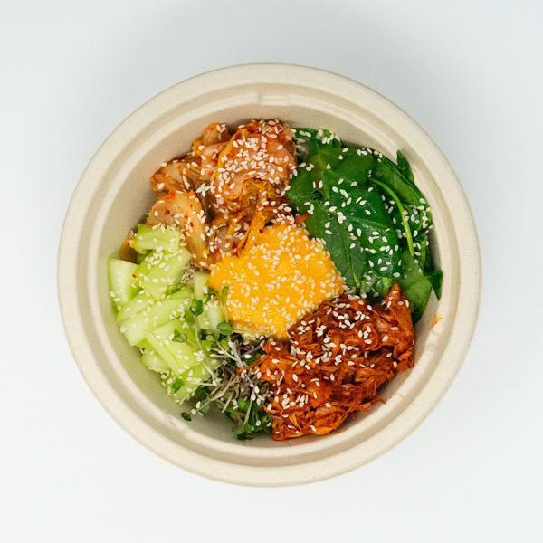 Seoul Bowl · Buckwheat, gochujang jackfruit, sprouts, spinach, cucumber, vegan kimchi, pepper sauce, sesame seeds, and sesame oil.