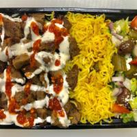 3. Lamb Gyro over Spicy Rice · Chopped tender lean gyro style lamb meat ( Infused  with 30% beef ) over spicy rice ,side of...