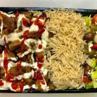 4. Lamb Gyro over Regular Rice · Chopped tender lean gyro style lamb meat ( infused  with 30% beef ) over seasoned regular ri...