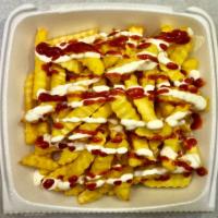 Loaded Fries · seasoned, loaded with white and siracha sauces . 
