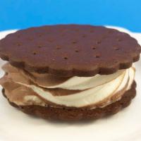 Ice Cream Sandwich · Rich vanilla, chocolate or swirl ice cream between chocolate wafers.