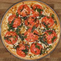 Margharita Pizza · Olive oil, garlic and oregano, topped with mozzarella, fresh tomato and basil. Vegetarian.