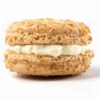 Coconut Cake · Our coconut-infused macaron contains a plain white shell covered in coconut shavings and fil...