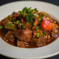 Mechado · Filipino-style beef stew with potatoes, carrots, bell peppers and spices.