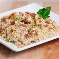 Pork Adobo Fried Rice · Served with pork adobo chinks, egg and green onions. Flavored with savory adobo seasoning.