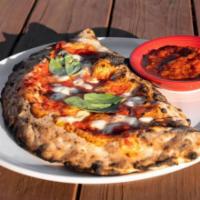 Willie Calzone · Wood-fired calzone filled with pepperoni, meatballs, ricotta, housemade mozzarella, and toma...