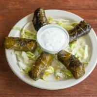 Vegetarian Grape Leaves (5 pcs) (V) · Rolled grape leaves stuffed with rice, onions, tomatoes and parsley. Cooked in seasoned lemo...