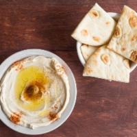 Hummus (Regular) · Garbanzo beans, garlic, tahini sauce topped with olive oil served with pita bread.