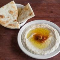 Regular Baba Ghanouge (Eggplant Dip) · Charbroiled eggplant mixed with sesame seed sauce, garlic, and lemon juice served with pita ...