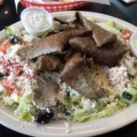 Lamb Gyros Salad · Greek salad topped with lamb gyro.