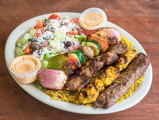 The Blazin' Platter · 4 flame grilled skewers of chicken, kafta, lamb skewers, and vegetables (one skewer of each). Served on a bed of rice and Greek salad. Feta cheese, our signature Blazin' Sauce and dressing. Fire grilled marinated lamb served in grilled pita bread with lettuce, tomatoes, onions and pickles topped with your choice of sauce. *All kebabs are fresh, fire grilled and made to order. Please allow additional time to cook.