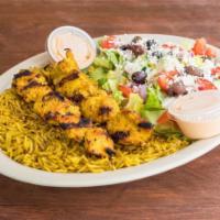 Chicken Kebab Platter · 2 skewers of seasoned charbroiled chicken kebab served on a bed of rice along with Greek sal...