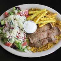 Greek Combination Platter · Thin sliced gyro meat and seasoned chicken gyro strips served on a bed of rice along with Gr...